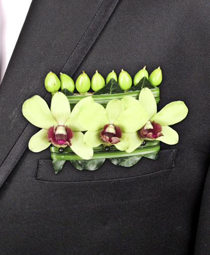 This is a unique take on a pocket square with the green flowers and fun details.